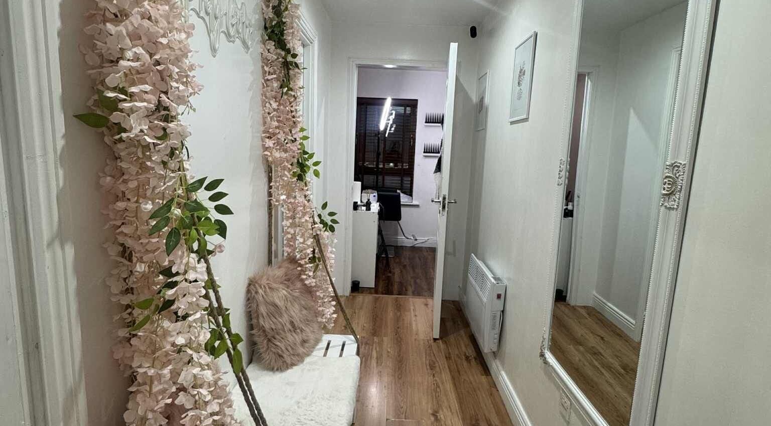 Elegant hallway of Elle Esthetics: Ashbourne Skin & Laser Clinic, Ashbourne, County Meath, IE with floral decor.