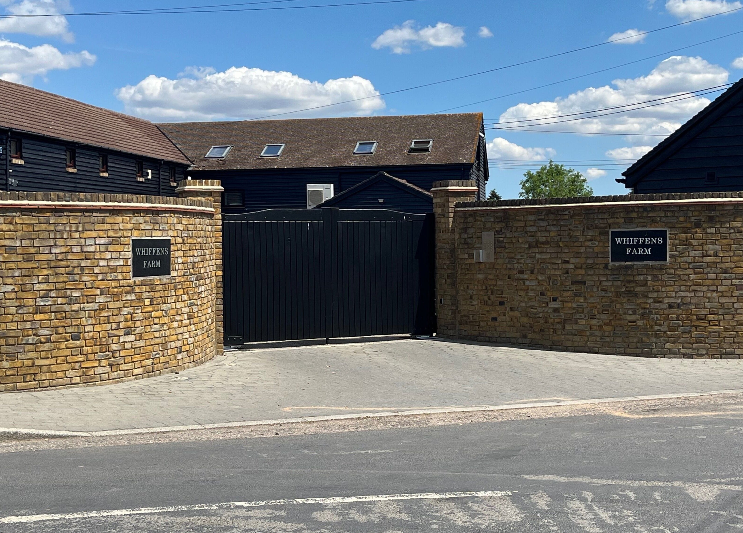 Entrance to Fern Bodyworks, Whiffens Farm, Hextable, England, GB with rustic brick walls.