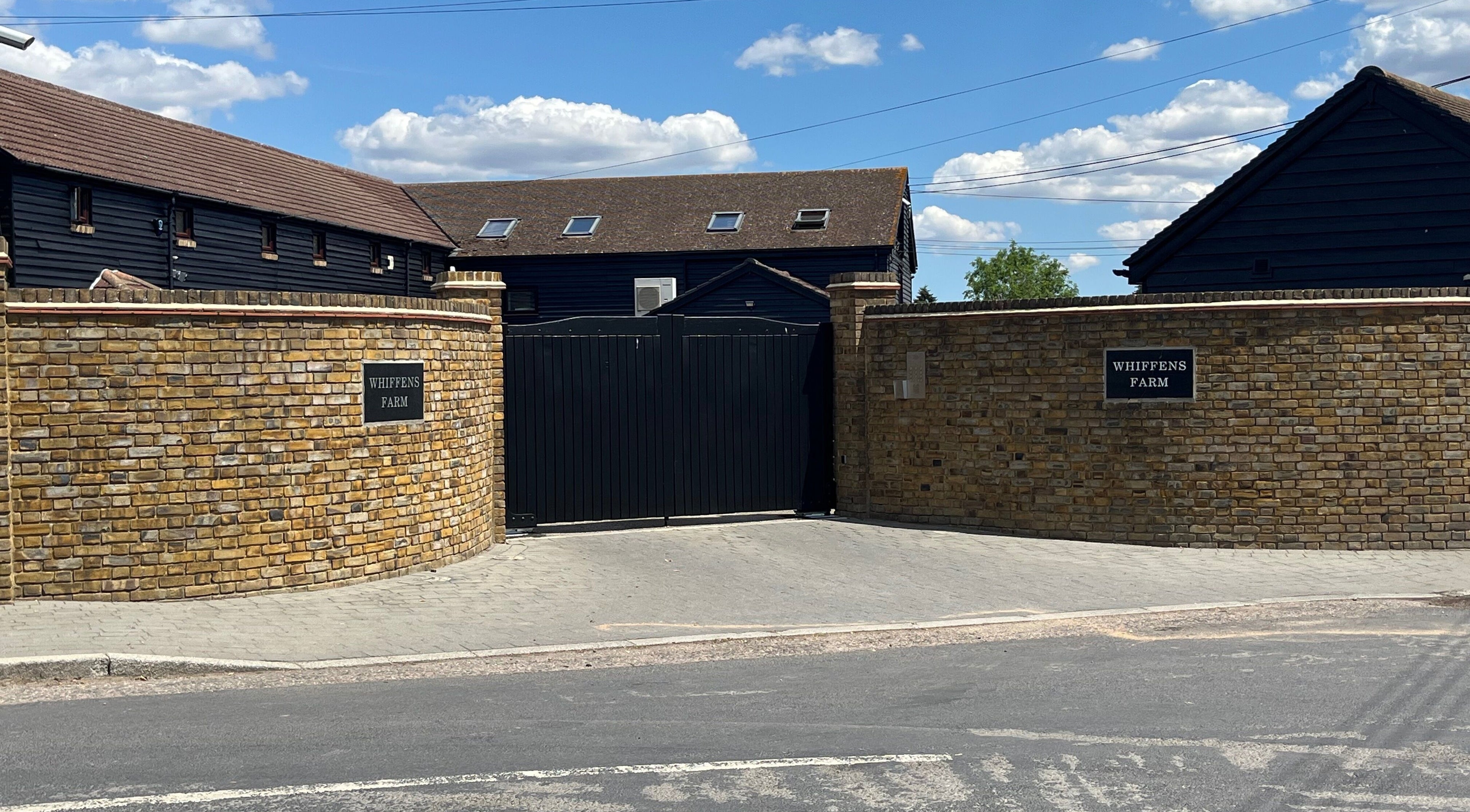 Entrance to Fern Bodyworks, Whiffens Farm, Hextable, England, GB with rustic brick walls.
