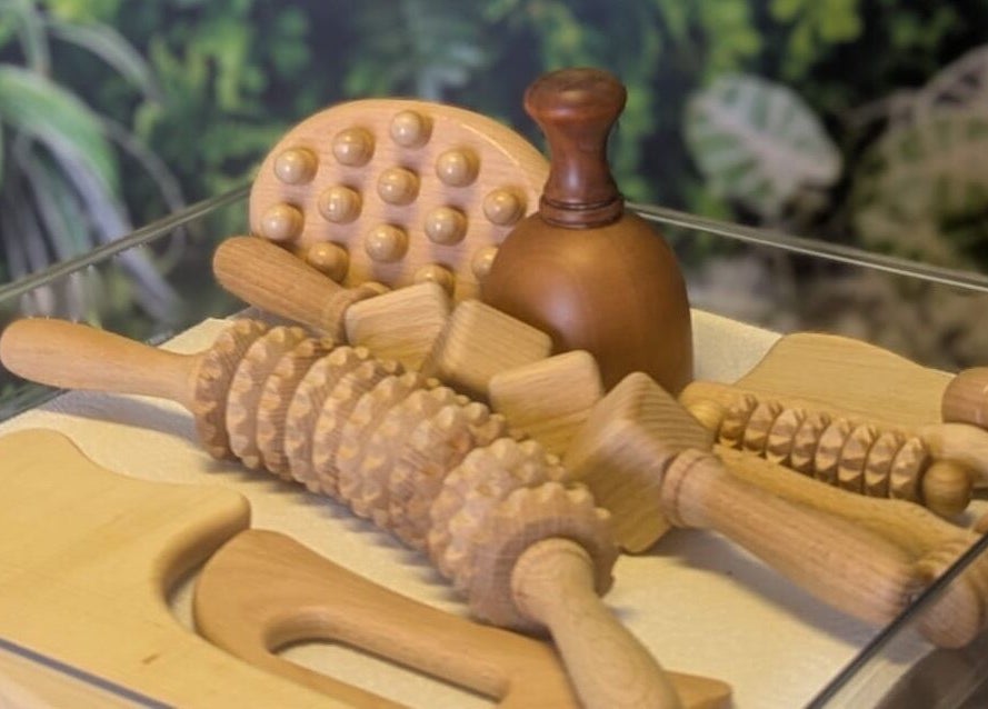 Wooden massage tools at Fern Bodyworks, Hextable, England, GB, enhancing a natural relaxing environment.