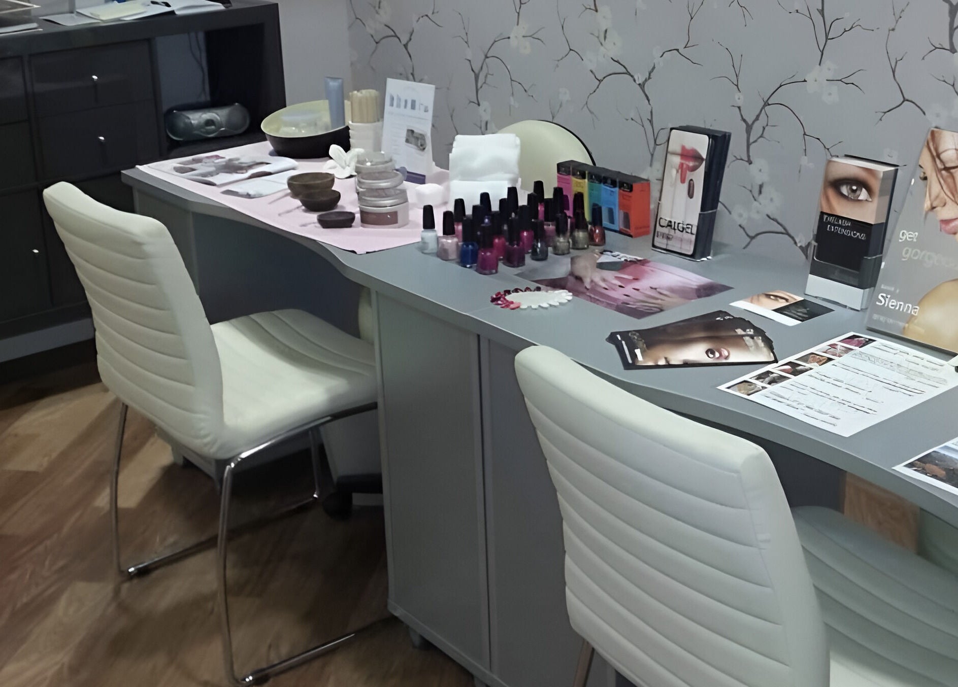 Modern nail salon at Baobab Tree Beauty, Belper, England, GB, showcasing manicure tools and vibrant nail polishes.