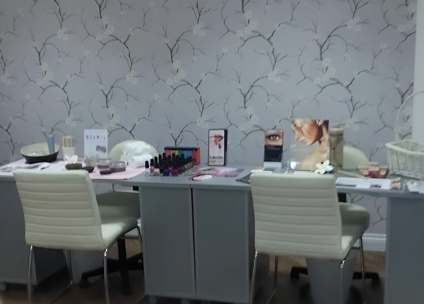 Cozy beauty station at Baobab Tree Beauty, Belper, England, GB with skincare products and nail polish.