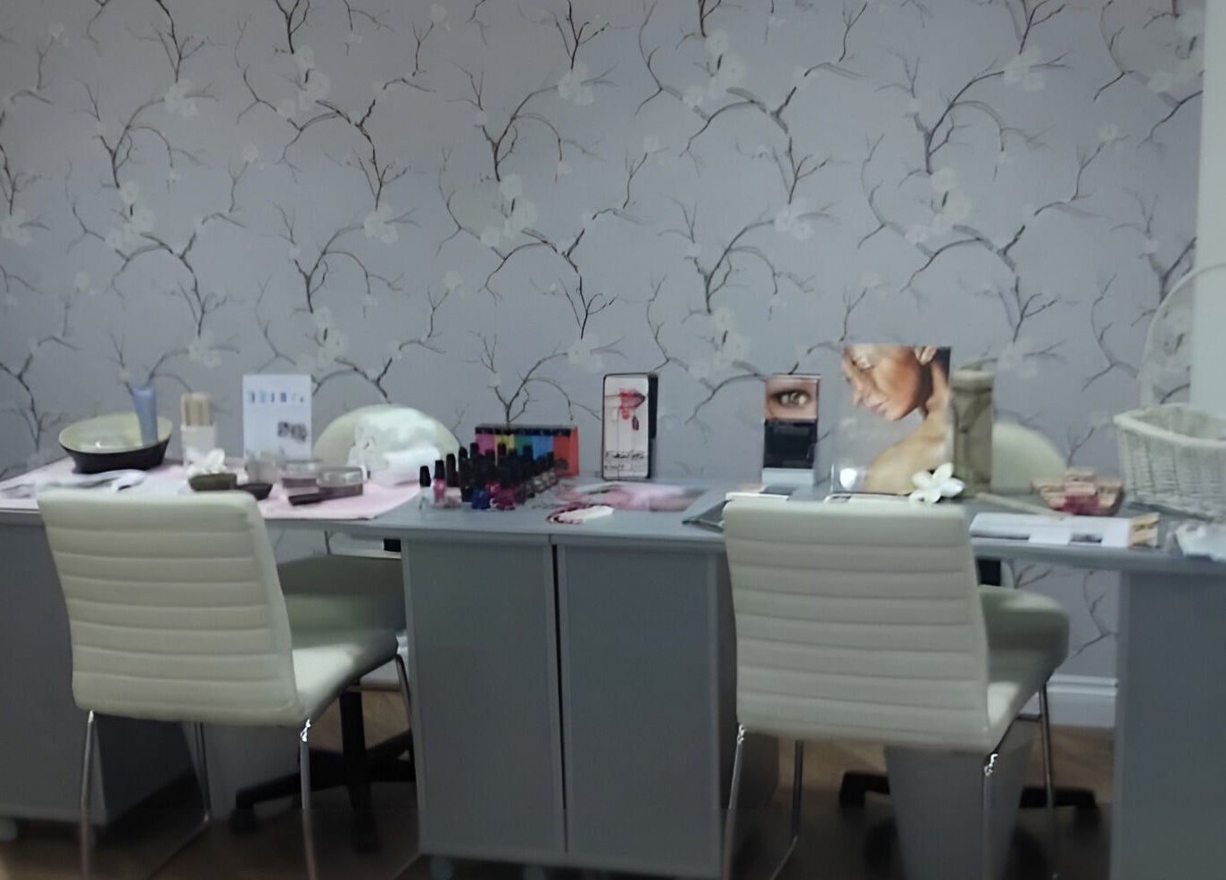 Cozy beauty station at Baobab Tree Beauty, Belper, England, GB with skincare products and nail polish.