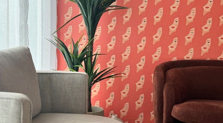 Chic seating area with vibrant wallpaper at Toowoomba Body Sculpting & Beauty Bar, Toowoomba, Queensland, AU.