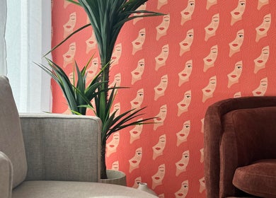 Stylish lounge at Toowoomba Body Sculpting & Beauty Bar in Toowoomba, Queensland, AU with artistic wallpaper.
