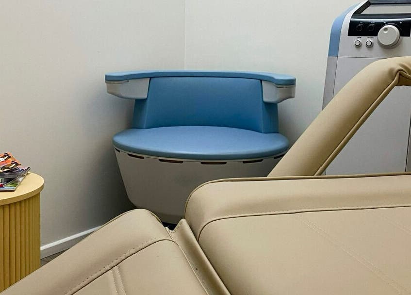 The Age Well Room in Maroochydore, Queensland, AU, featuring a serene treatment area with a comfortable chair.