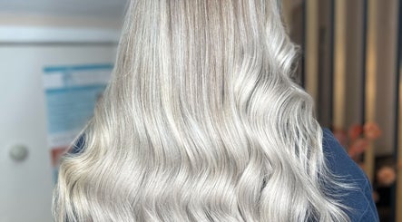 Elegant silver wavy hair styled at Hair by LAW in Worcester, England, GB, showcasing expert craftsmanship.