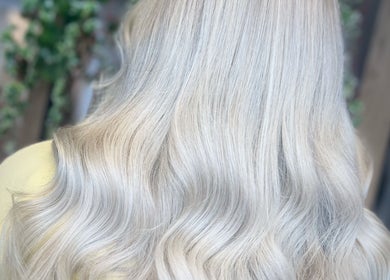 Silky blonde wavy hair styled at Hair by LAW in Worcester, England, GB, showcasing luxurious texture.