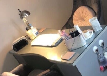 Cozy nail station at ER Beauty Lounge in Rochdale, England, GB, featuring elegant decor and manicure supplies.