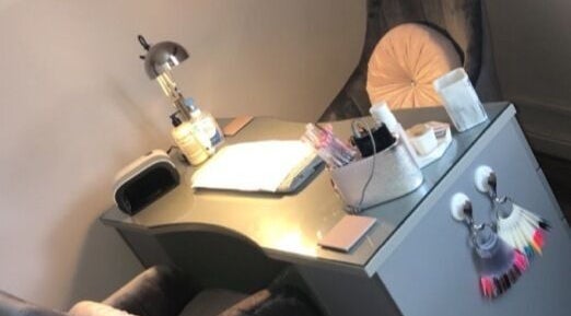 Cozy nail station at ER Beauty Lounge in Rochdale, England, GB, featuring elegant decor and manicure supplies.