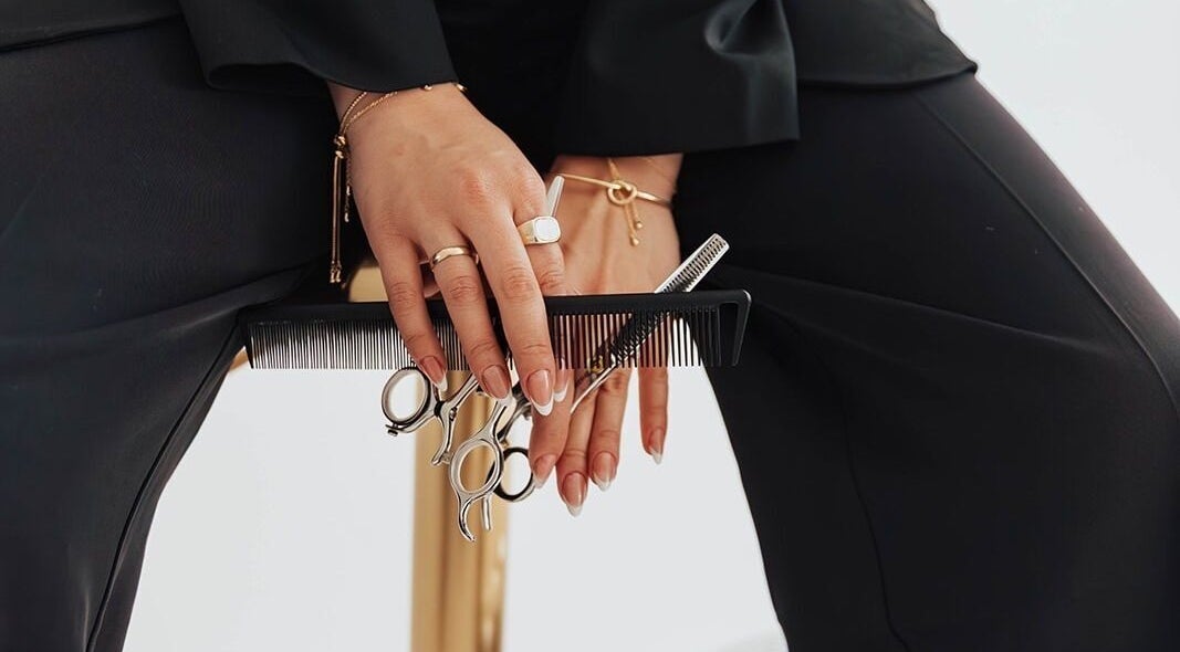 Hairstyling tools and elegant nails at Jocelyn Somers Hairstylist, Clarksville, Tennessee, US.