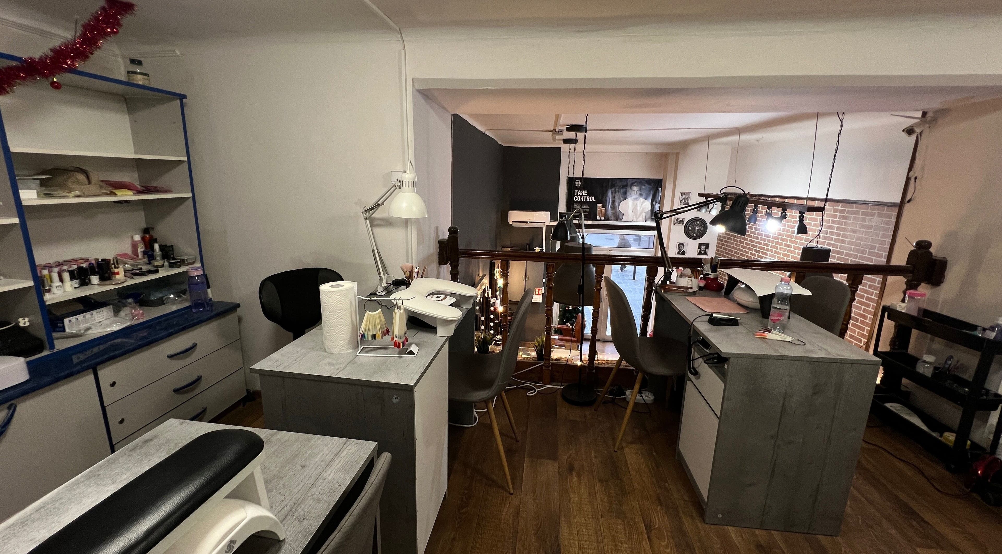 Interior of Shenail_beauty workspace in Budapest, Magyar, HU, featuring manicure tables and stylish decor.