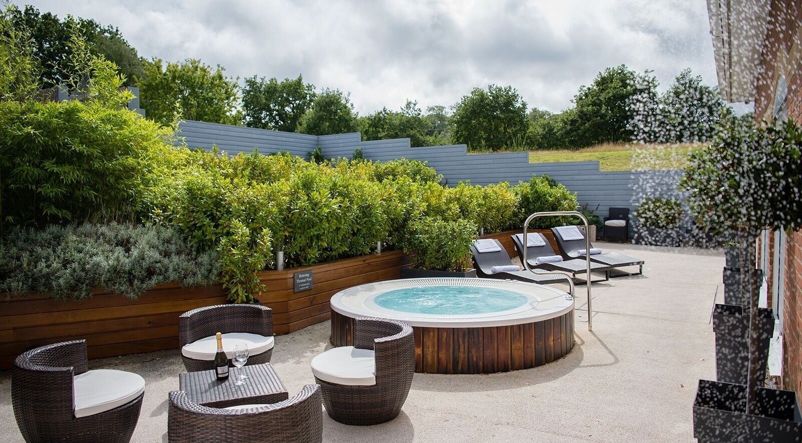 Outdoor jacuzzi and seating at The Spa at Lakeside Park Hotel, Wootton Bridge, England, GB.