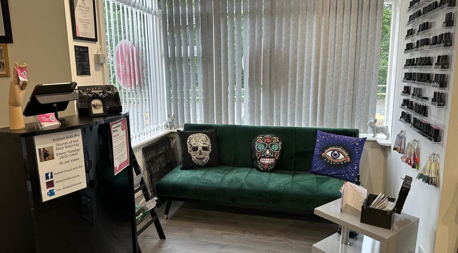 Cozy green sofa with eclectic pillows at Totally Polished, Village, England, GB.