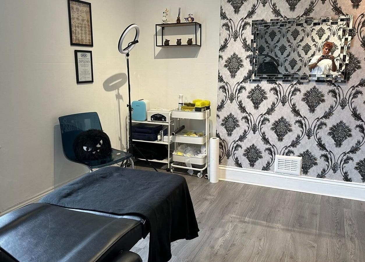 Modern treatment room at Totally Polished, Village, England, GB, featuring elegant decor and professional setup.