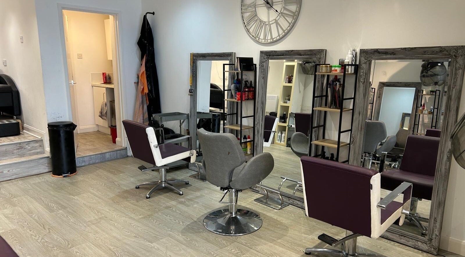 Elegant salon chairs at DiamzTouch, Birmingham, England, GB. Modern mirrors add sophistication.