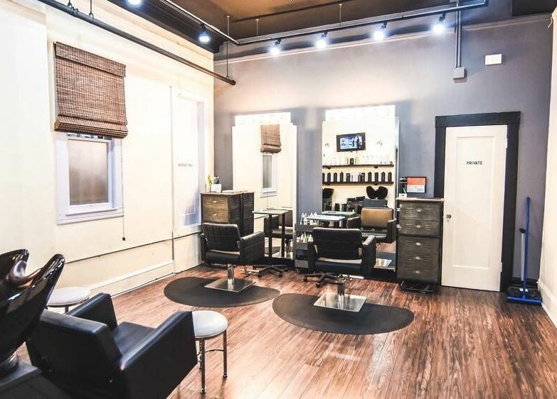 Modern salon interior at Dolled and Dapper Salon in San Francisco, California, US with sleek styling stations.