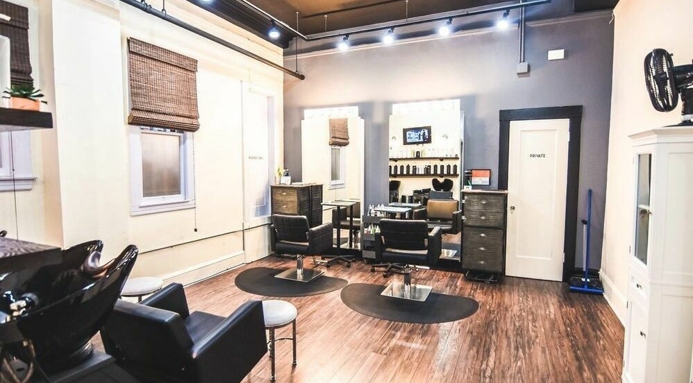 Modern salon interior at Dolled and Dapper Salon in San Francisco, California, US with sleek styling stations.