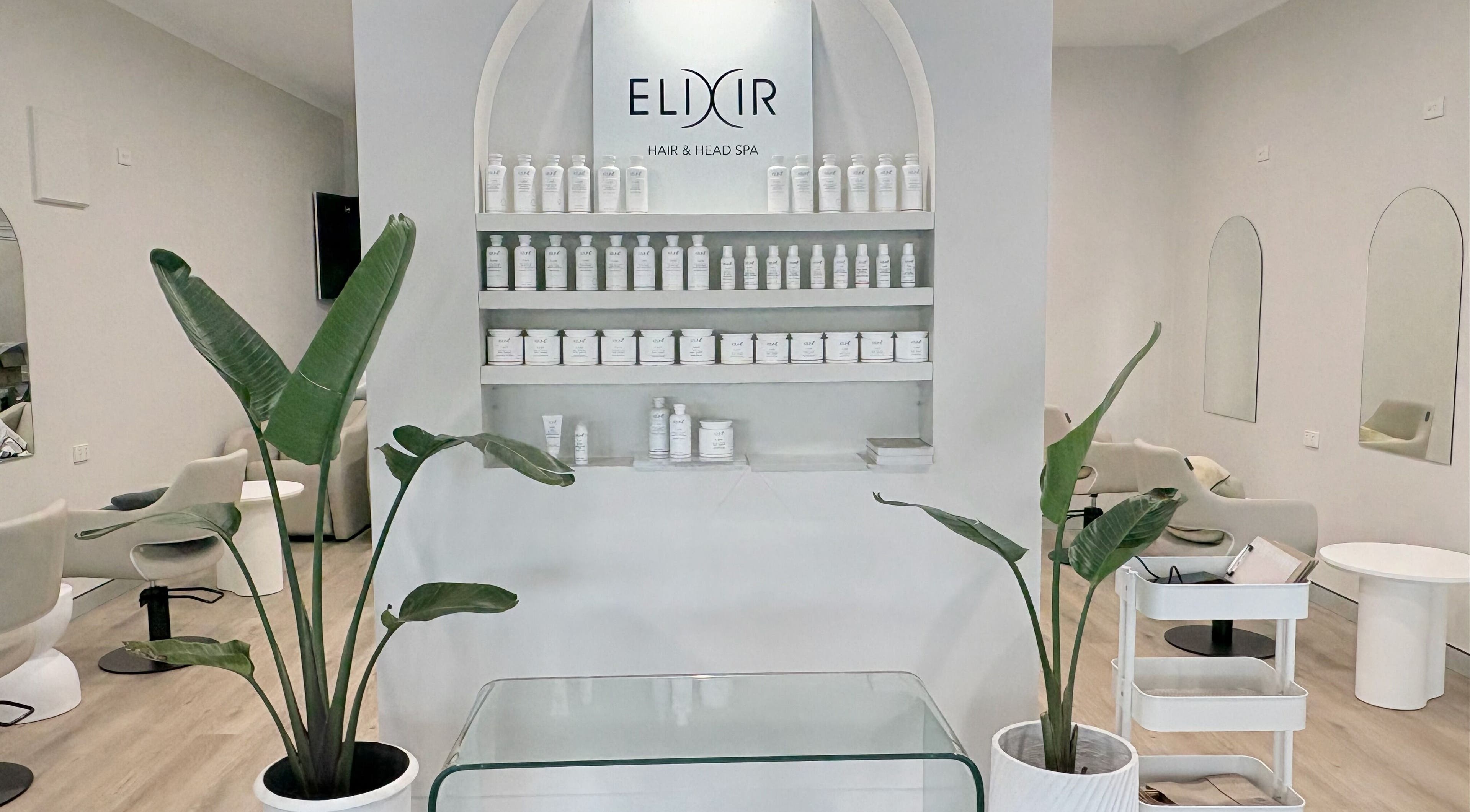 Elixir Hair & Head Spa Tugun interior with stylish decor and product display, Tugun, Queensland, AU.
