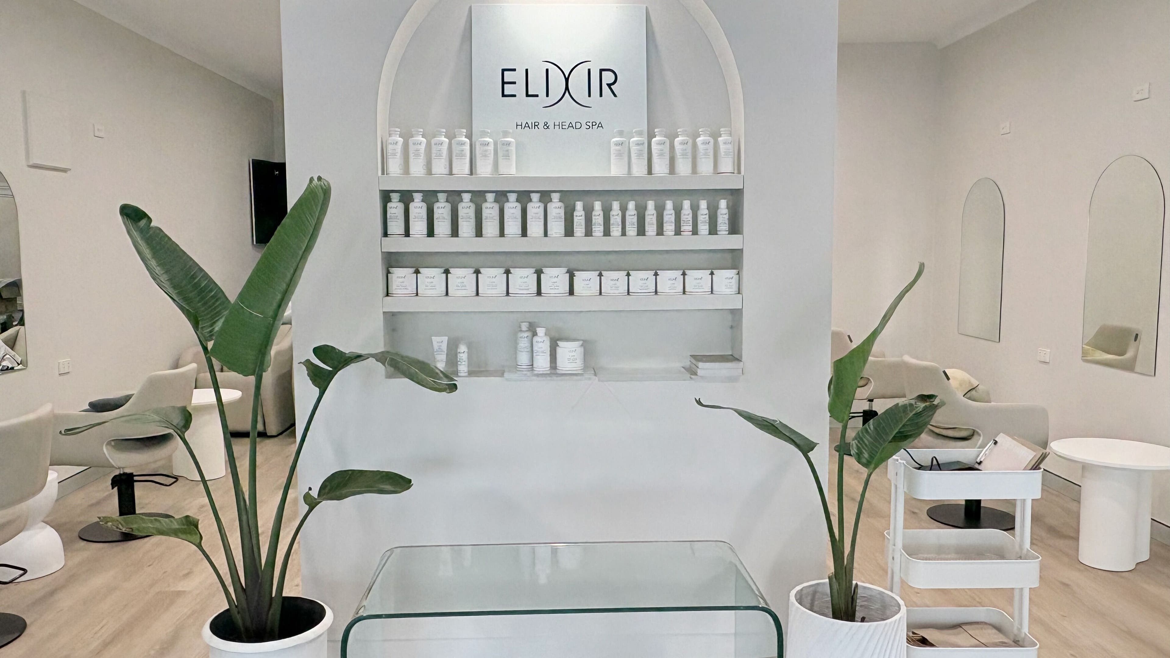 Elixir Hair & Head Spa Tugun interior with stylish decor and product display, Tugun, Queensland, AU.