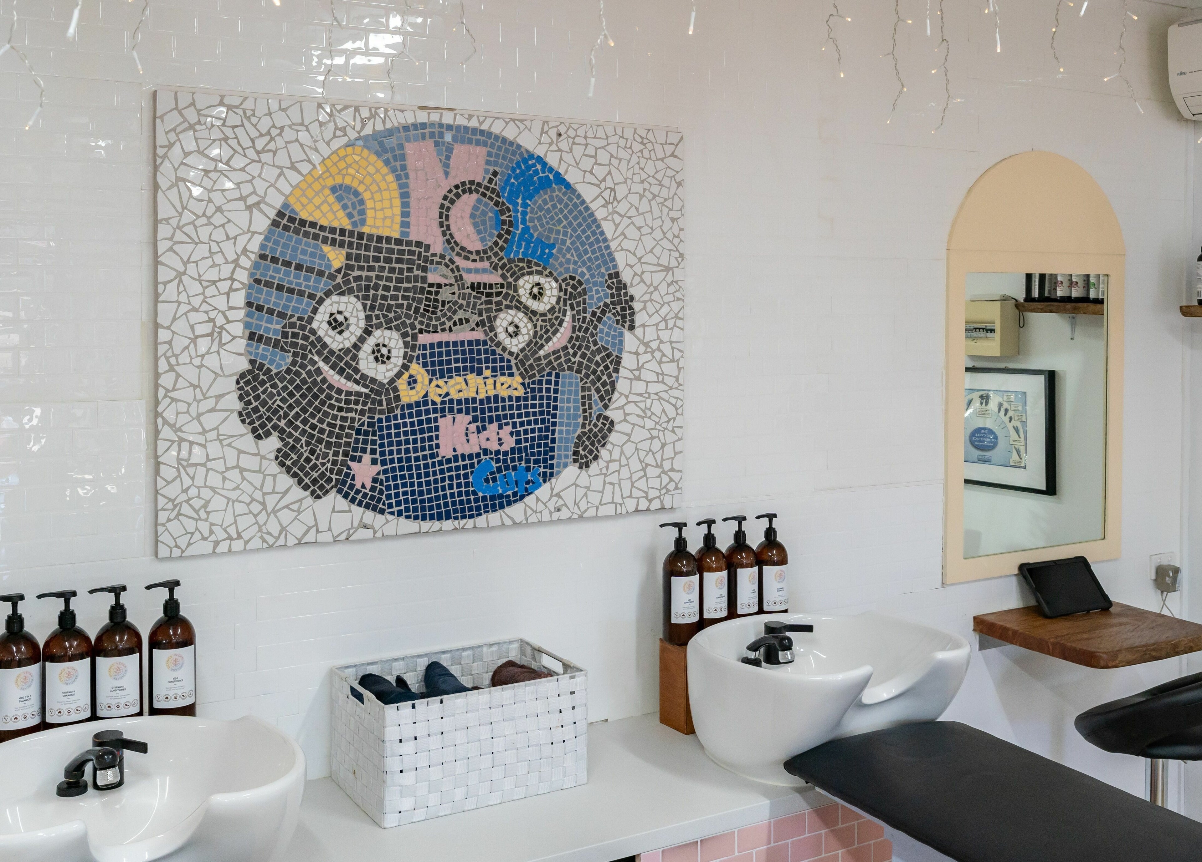 Interior of Deanies Kids Cuts with whimsical mosaic decor in Currimundi, Queensland, AU.