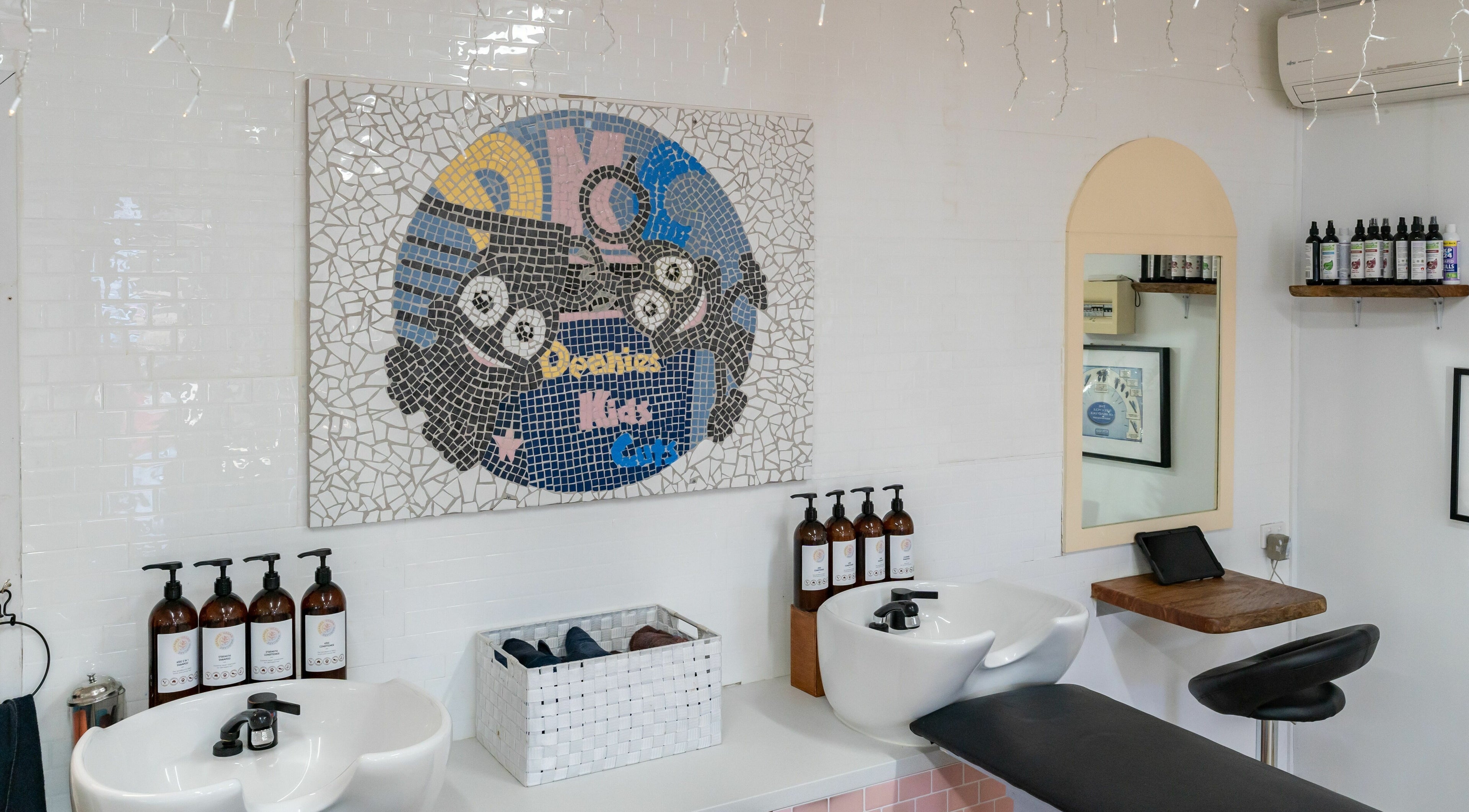 Interior of Deanies Kids Cuts with whimsical mosaic decor in Currimundi, Queensland, AU.