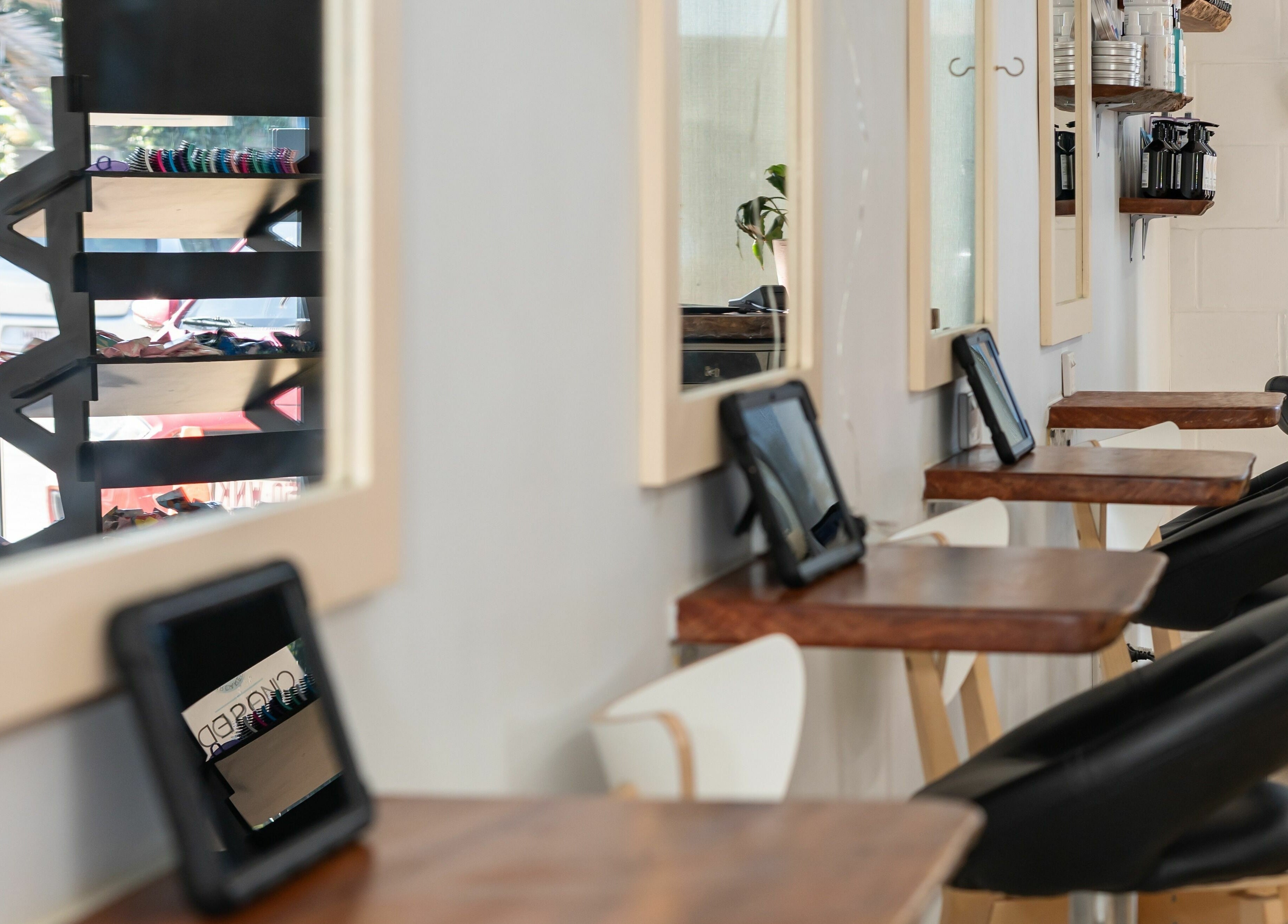 Interior of Deanies Kids Cuts in Currimundi, Queensland, AU, featuring styling stations and mirrors.