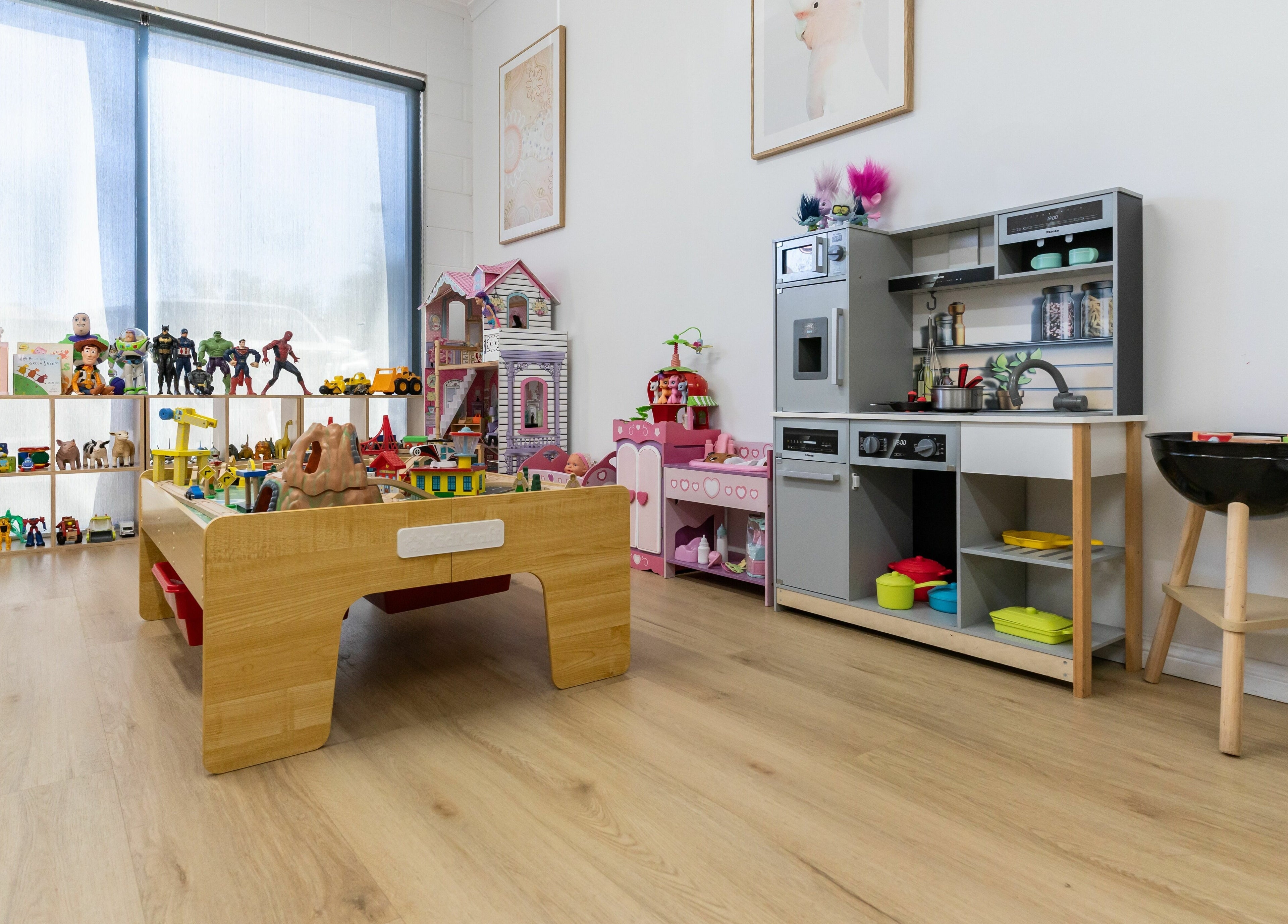 Bright play area at Deanies Kids Cuts in Currimundi, Queensland, AU featuring toys and a mini kitchen.