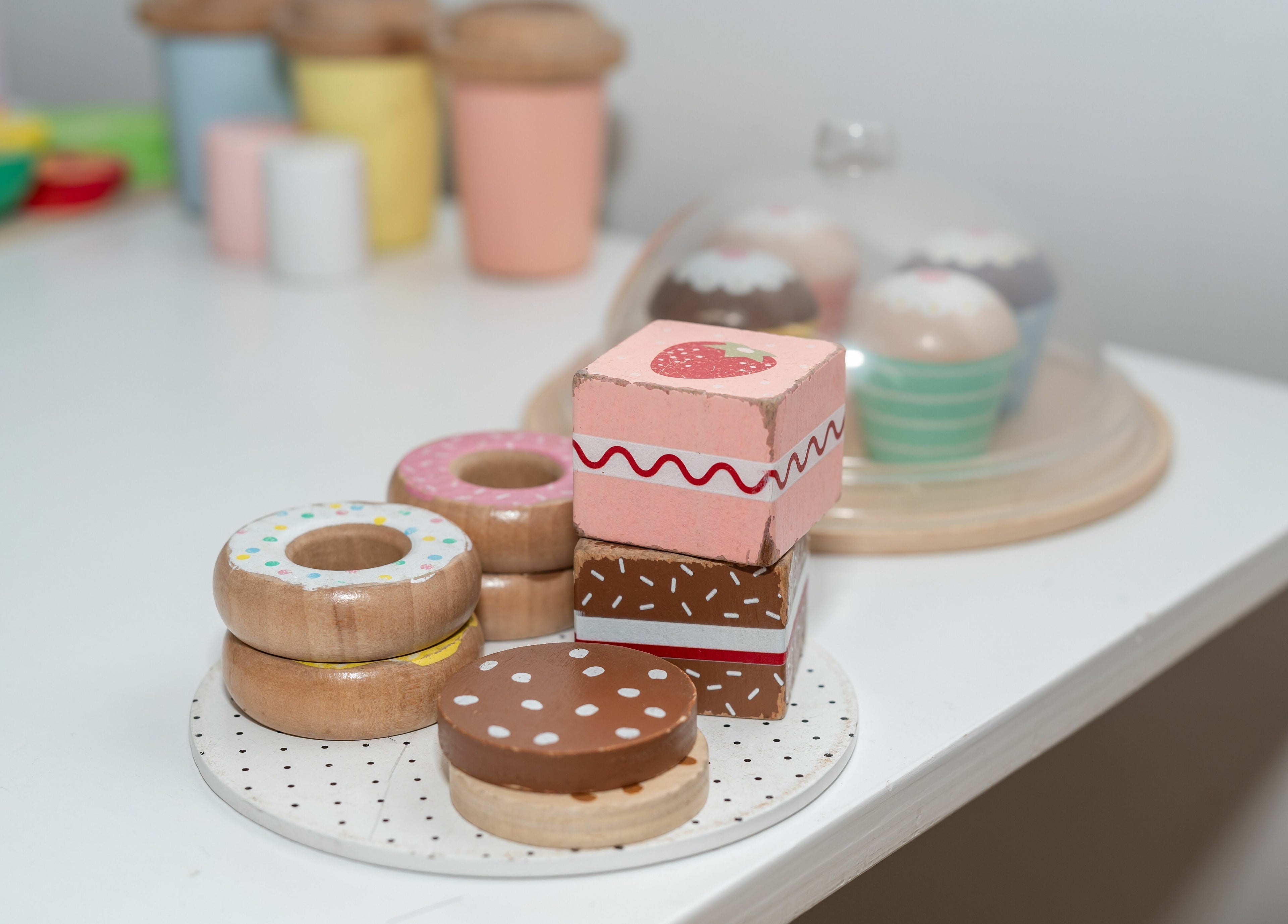 Colorful wooden play sweets at Deanies Kids Cuts, Currimundi, Queensland, AU.