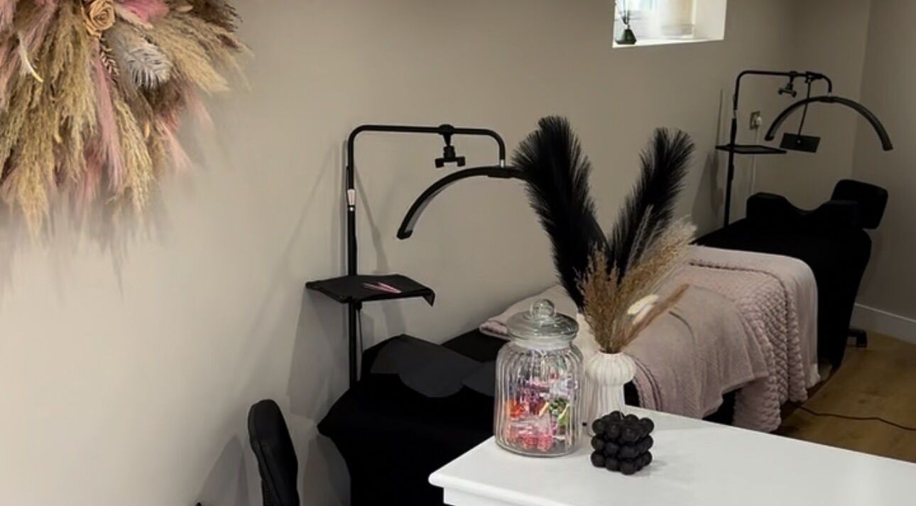 Elegant treatment room at The Doll Hause, Bournemouth, England, GB, featuring stylish decor and plush linens.