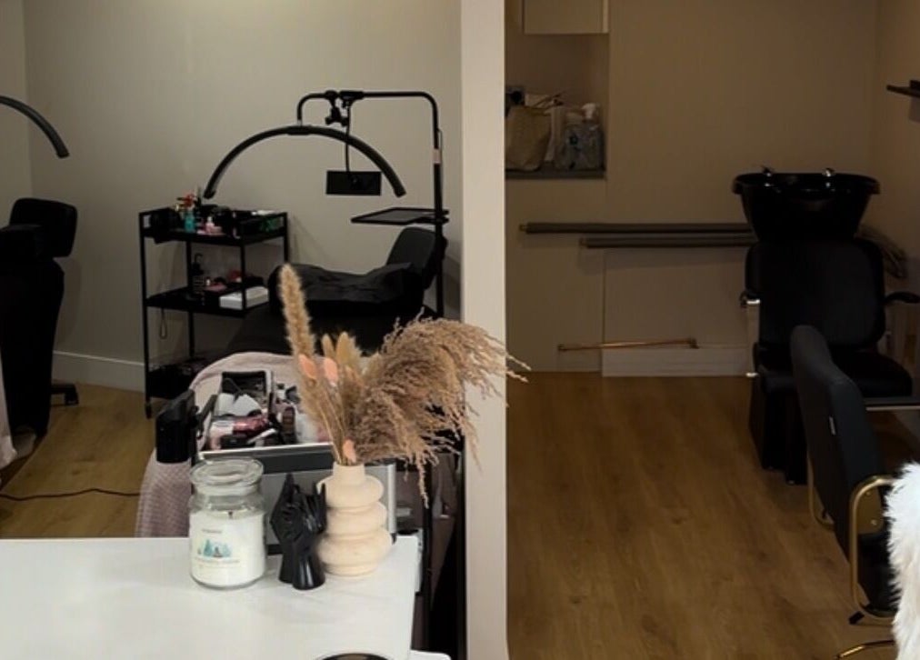 Tranquil treatment room at The Doll Hause, Bournemouth, England, GB, featuring elegant chairs and treatment tables.