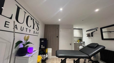 Lucy's Beauty Bar treatment room in Allington, England, GB with a modern aesthetic and comfortable setup.