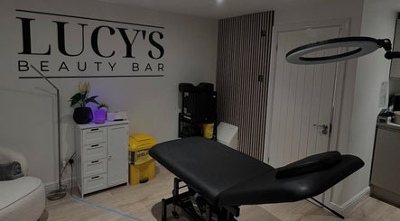 Relaxing interior of Lucy's Beauty Bar in Allington, England, GB featuring treatment table and elegant decor.
