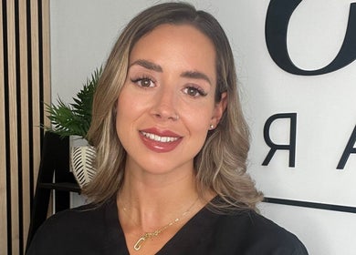 Staff member welcomes visitors at Lucy's Beauty Bar in Allington, England, GB.