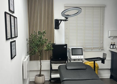 Elegant treatment room at Edit & Enhance By Lucy in Allington, England, GB, featuring modern equipment and decor.