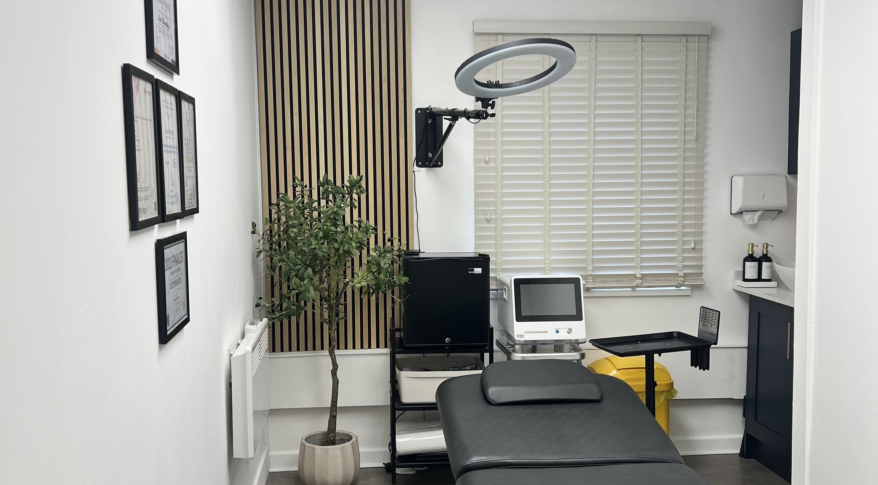 Elegant treatment room at Edit & Enhance By Lucy in Allington, England, GB, featuring modern equipment and decor.