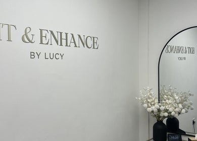 Interior of Edit & Enhance By Lucy, Allington, England, GB showcasing a stylish mirror and floral decor.