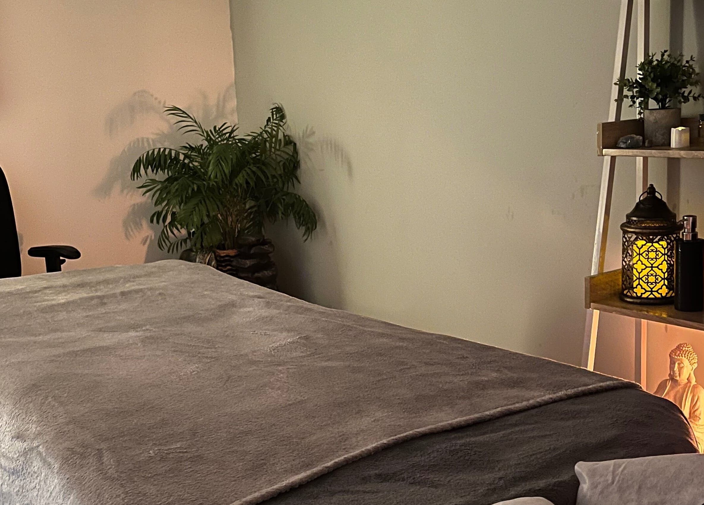 Calm therapy room at Jenny Lockyer Reflexology, Gosport, England, GB, with gentle lighting and soft textures.