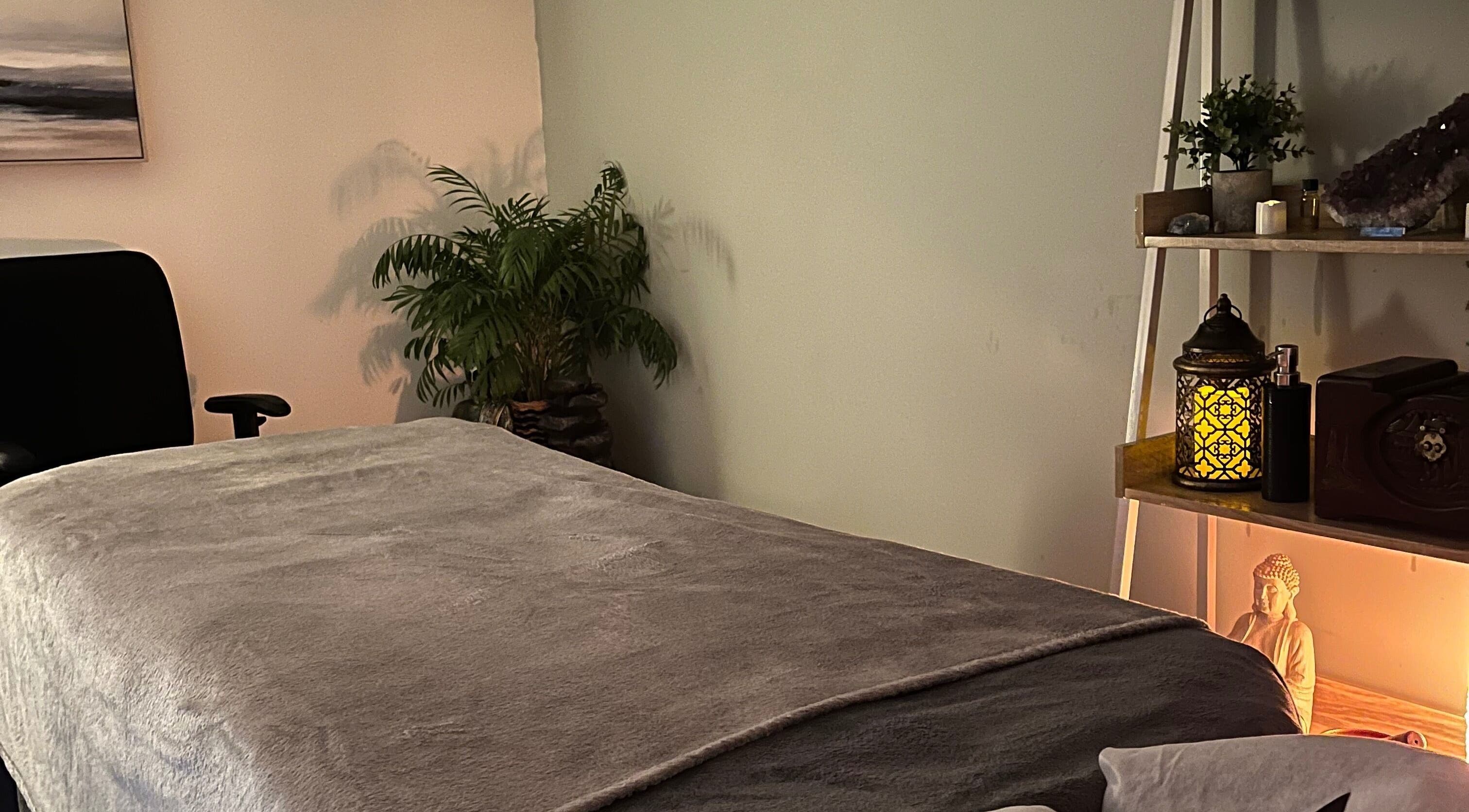 Calm therapy room at Jenny Lockyer Reflexology, Gosport, England, GB, with gentle lighting and soft textures.