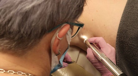 Expert performing precision skin treatment at Warwickshire Aesthetics Collective, Stratford-upon-Avon, England, GB.