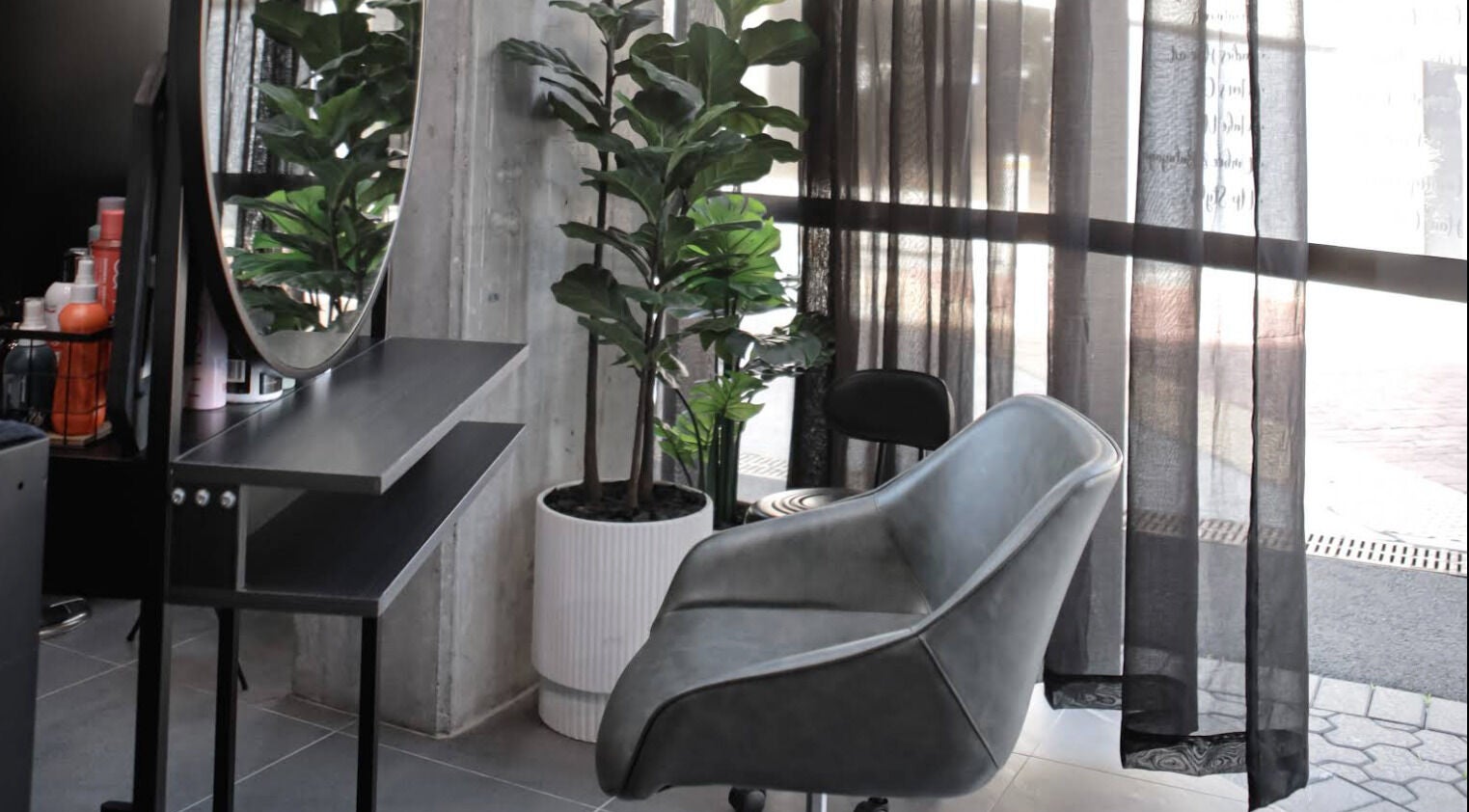 Stylish seating and vanity at Cheveu Salon, Sydney Olympic Park, New South Wales, AU.