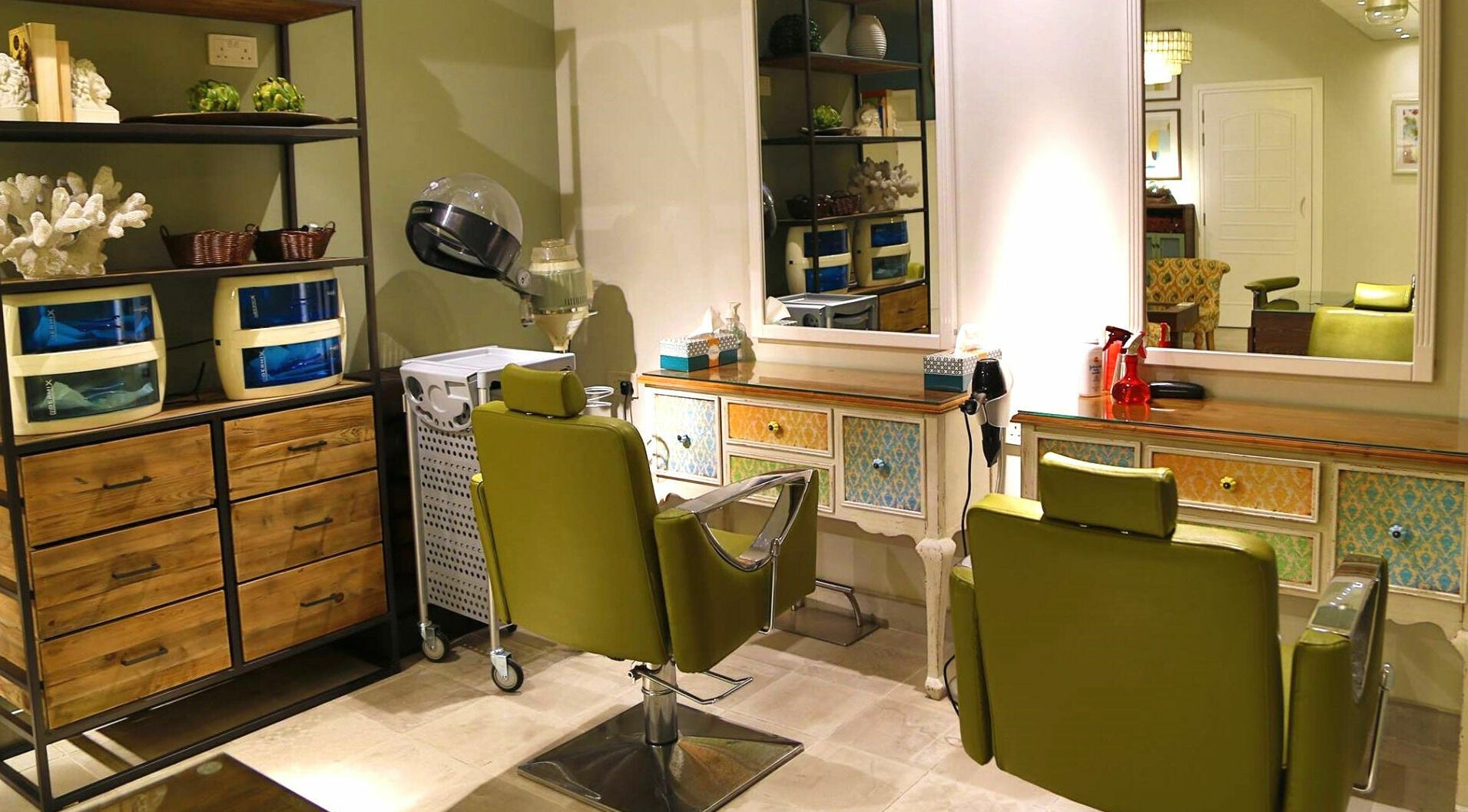 Modern salon interior at Serene Beauty & Spa, Abu Dhabi offers comfort and style in vibrant green chairs.