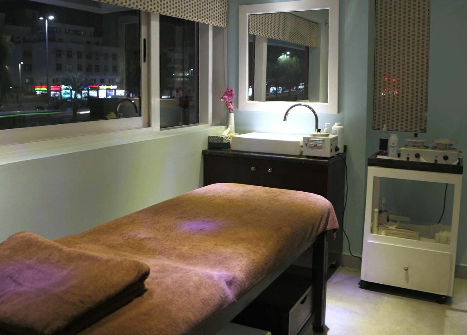 Cozy treatment room at Serene Beauty & Spa in Abu Dhabi with a massage table and tranquil lighting.