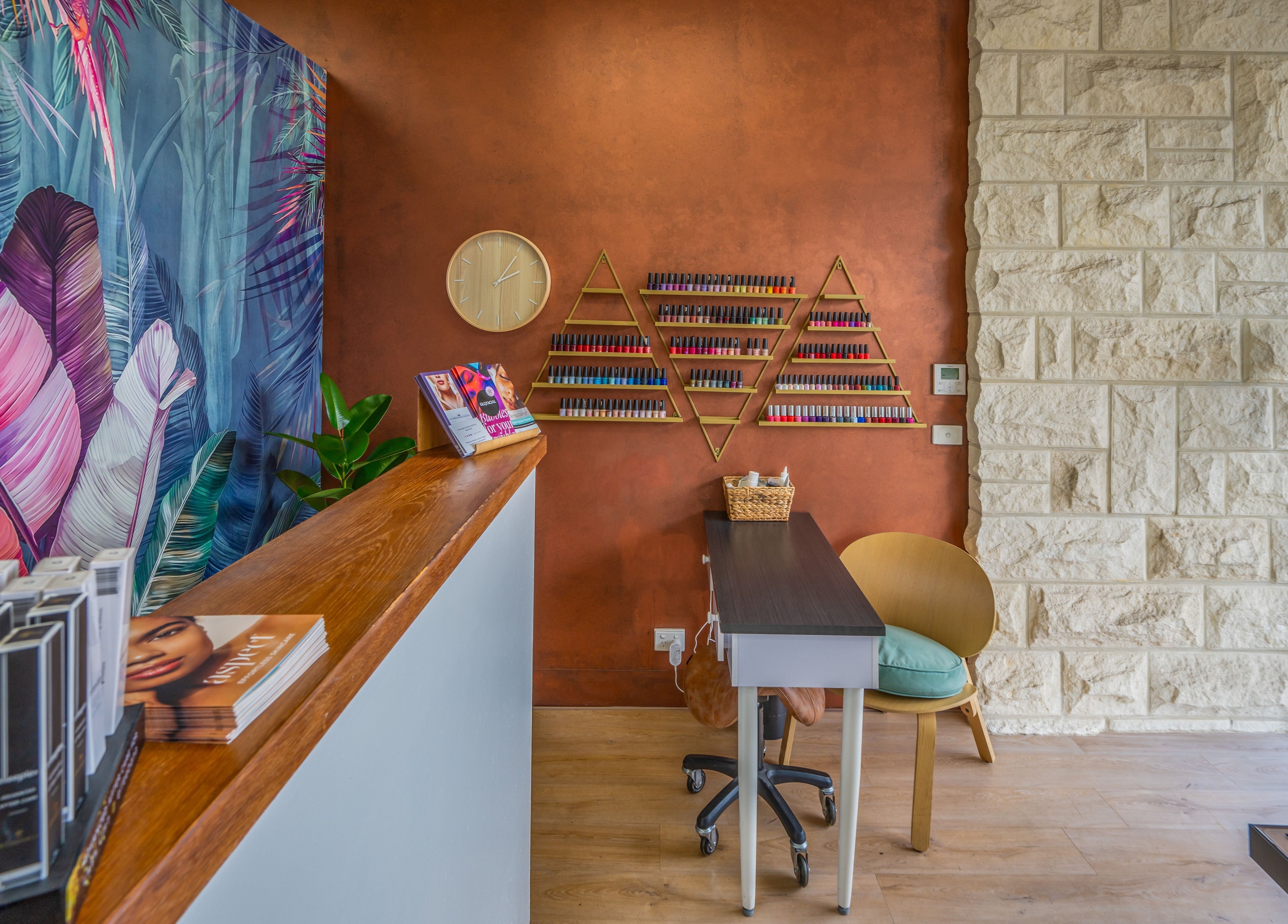 Stylish reception at Sorrento Skin and Beauty, Sorrento, Victoria, AU with vibrant mural and warm decor.