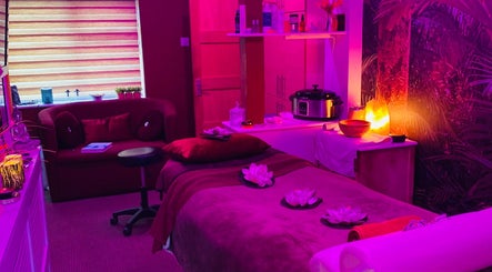 Relaxing spa room at Body & Soul Luxury Treatments, Exmouth, England, GB, featuring ambient lighting and decor.