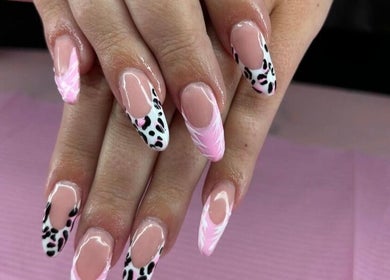 Stylish nail art featuring pink and leopard designs at Bella Lina Salon, Warwick, Rhode Island, US.