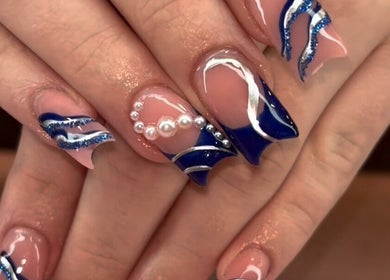 Elegant blue and silver nail art with pearls at Bella Lina Salon, Warwick, Rhode Island, US.