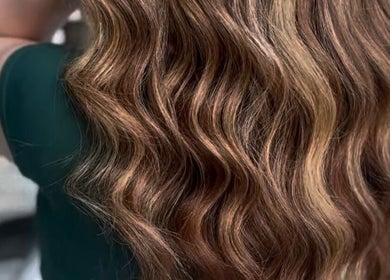 Luxurious wavy hair styled at Bella Lina Salon in Warwick, Rhode Island, US.