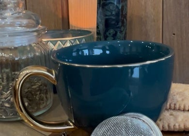 Teal cup and biscuits arranged for relaxation at The Hair Room at Mawson, Mawson, Australian Capital Territory, AU.
