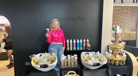 A joyful event at THE Hairdressers in Lowestoft, England, showcasing vibrant decor and beauty products.